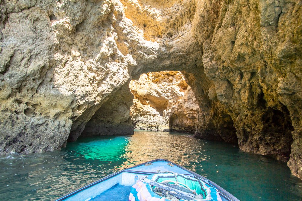 Beautiful view of cliffs of the Ponta da Piedade on Algarve coast, taking a boat tour through the stunning cave formations