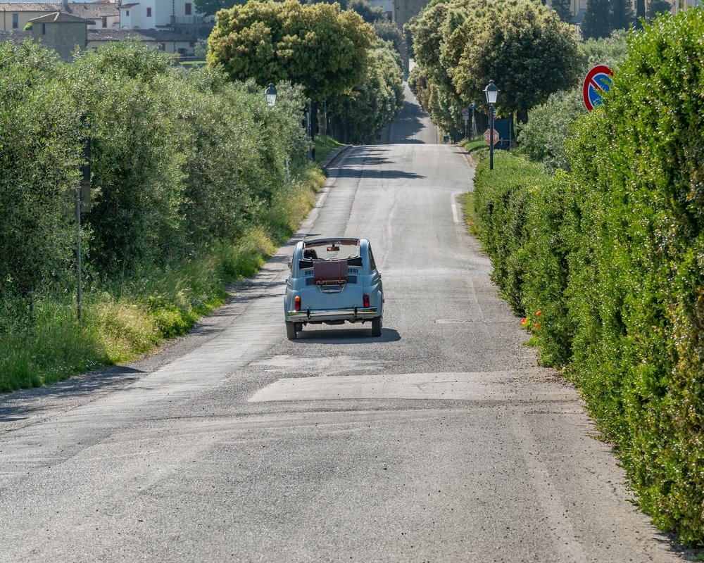 backroads of tuscany in a small cute car
