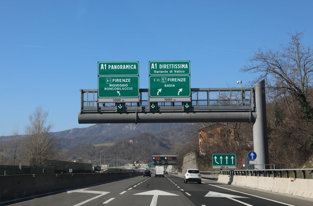 highway sign with the signs of the junction to go to Florence on the panoramic road or on the Direttissima road (a direct route that is not as scenic)