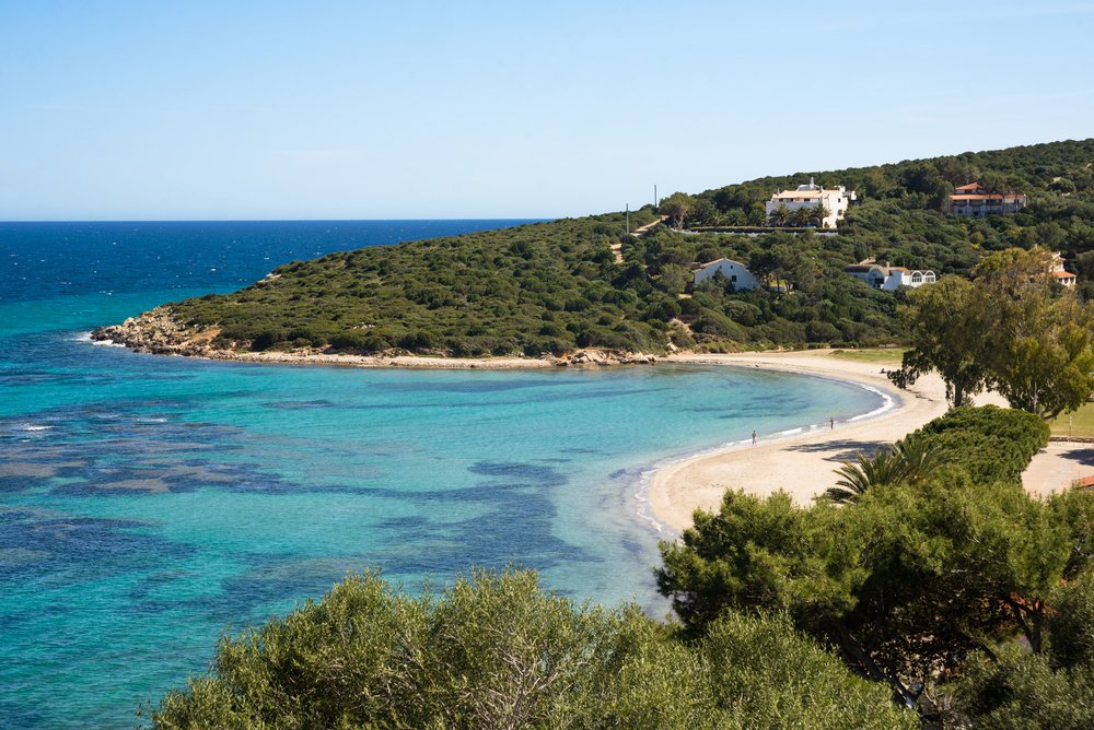 The beautiful Maladroxia beach with curving, white sandy shoreline on Sant Antioco island of Sardinia