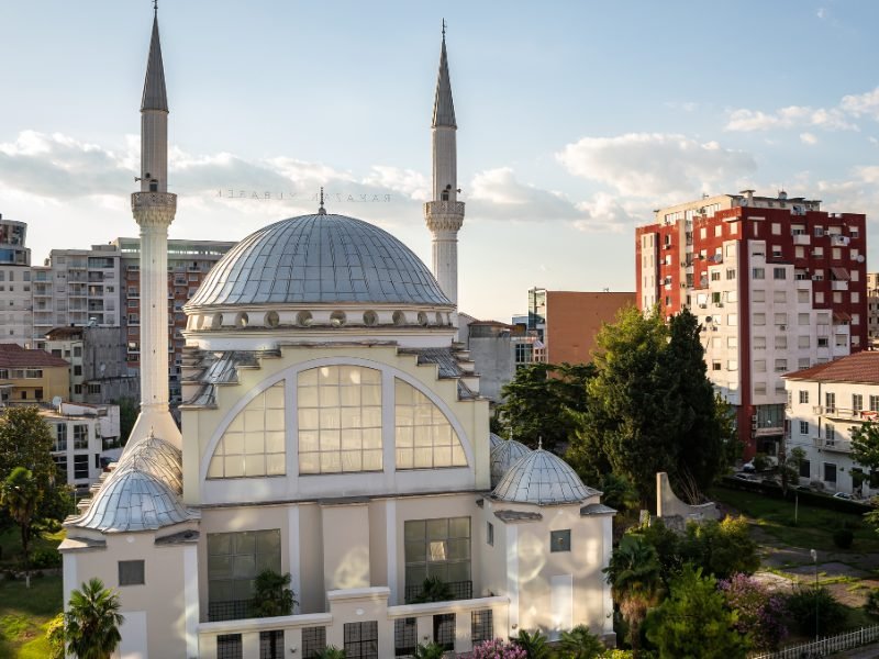 Afternoon light on the Shkodra mosque in the city center with minarets and covered domes