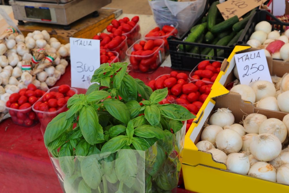 Basil, garlic, and cherry tomatoes at a market in Palermo sicily