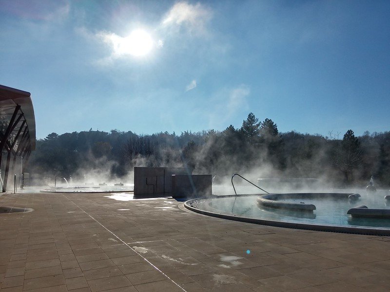 Steam rising from hot springs in Theia Thermal Baths in Tuscany