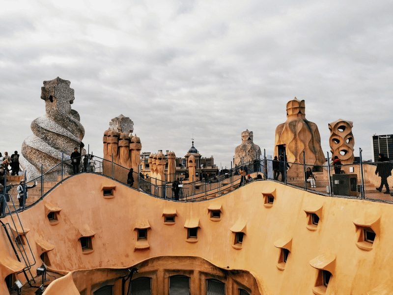 The strange and fantastical stone-colored roof of Gaudi's casa mila building which looks like a stone quarry