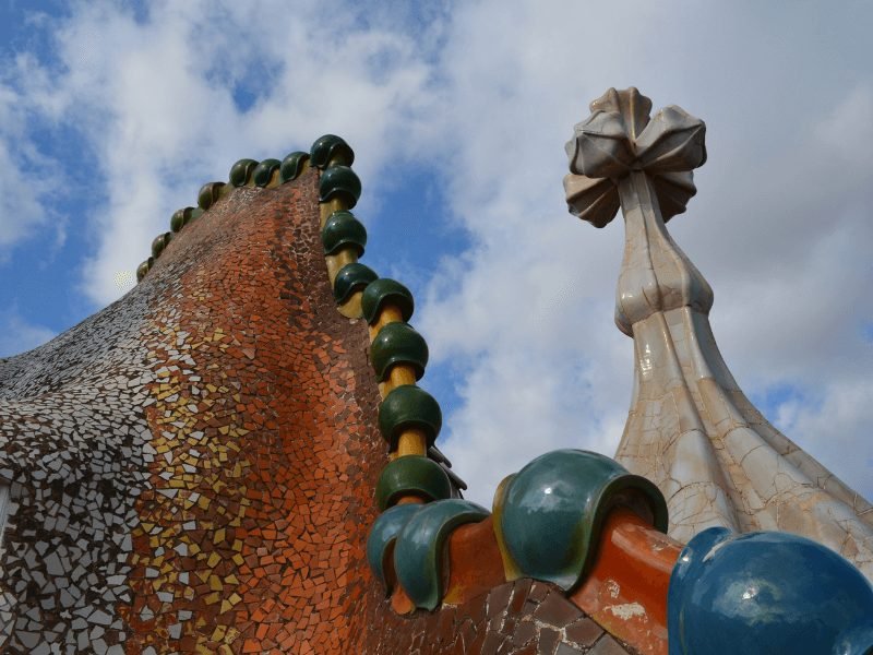 the strange, fairytale like rooftop of gaudi's casa battle with what looks like a dragon back