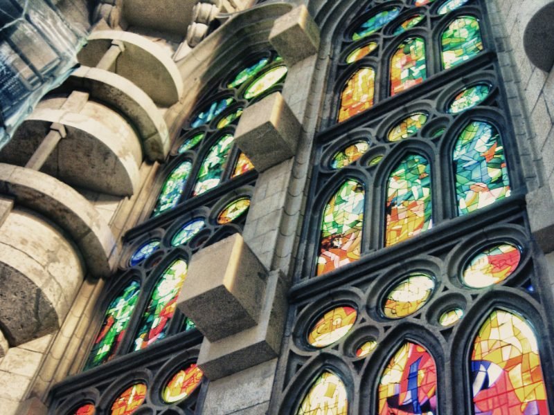 The interior stain glass work of Gaudi's Barcelona church, a basilica in Barcelona