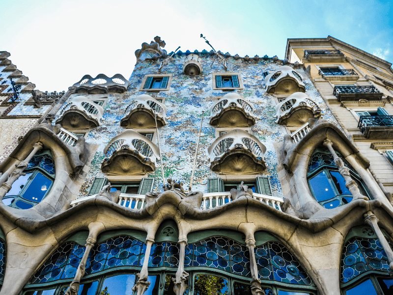 The colorful architecture of Casa Battlo in Barcelona, one of the more whimsical gaudi buildings in Barcelona