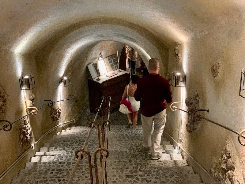 Entering the stairs down to the cave for the wine museum