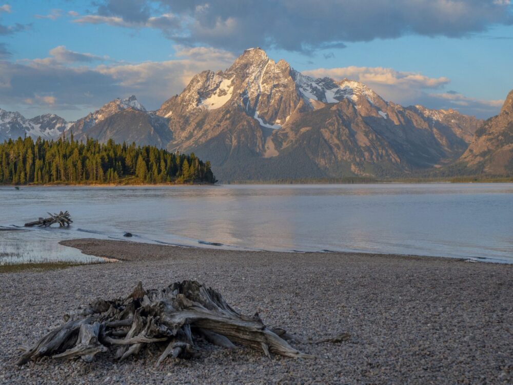 Colter Bay view at sunrise with pretty pastel colors and calm lake