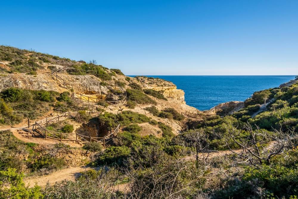 Beautiful cliffs and rock formations by the Atlantic Ocean at Seven Hanging Valleys Trail in Algarve, Portugal