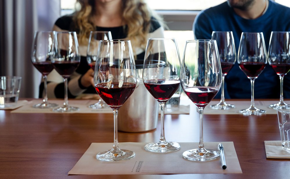 Wine tasting experience in Langhe (Italy) with three glasses of Nebbiolo on a table