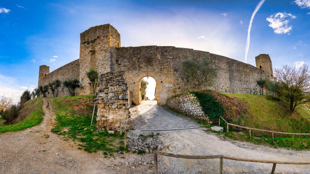 old castle preserved well with arch, towers, walls, gate