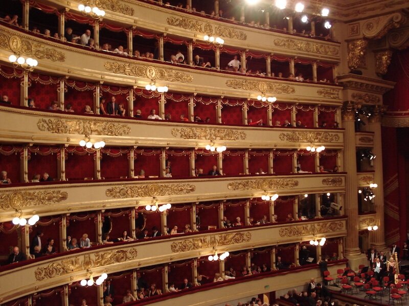 the red velvet boxes and gilded gold decoration of the theater in milan at la scala theater