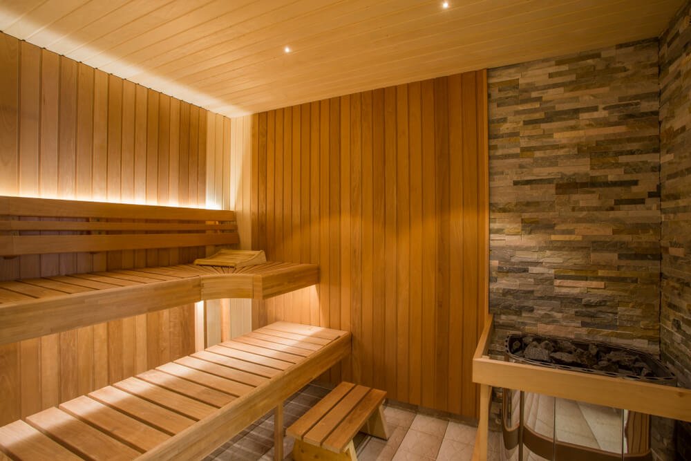a lovely relaxing indoor wood dry sauna with rocks