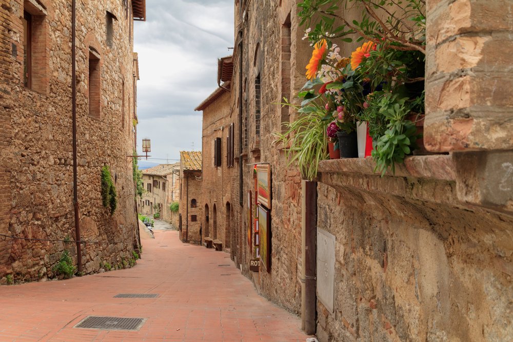 Narrow town streets in Monteriggioni town in Tuscany
