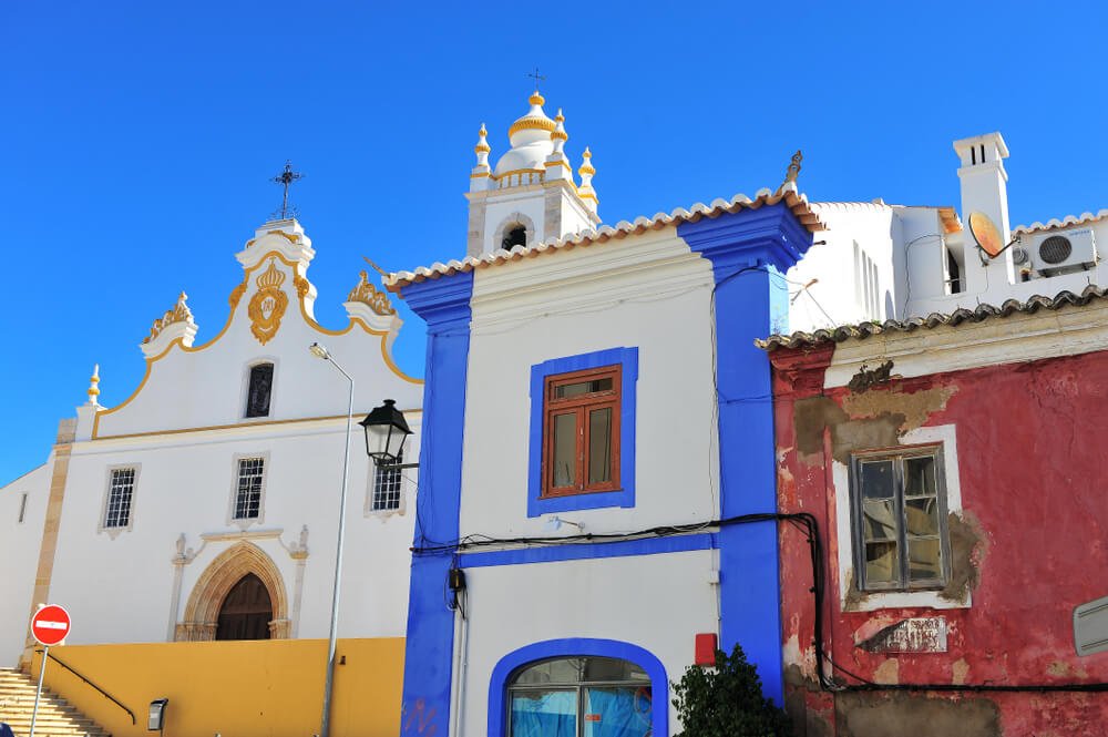 Colorful houses of Portimao old town, Portugal, red, yellow, and blue painted colors