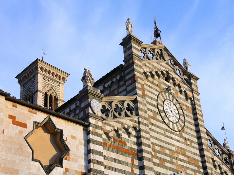 A church in the heart of Prato with striped brick detail, cutouts, clock, etc.