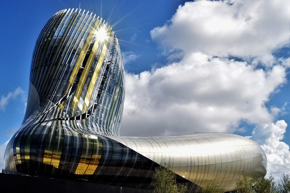 wine museum in bordeaux with shiny architecture and clouds and sky