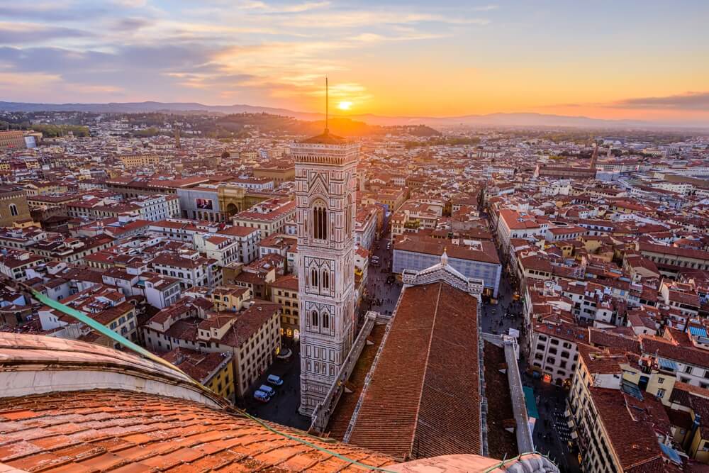 sunset from the dome of the florence duomo with the belltower in view