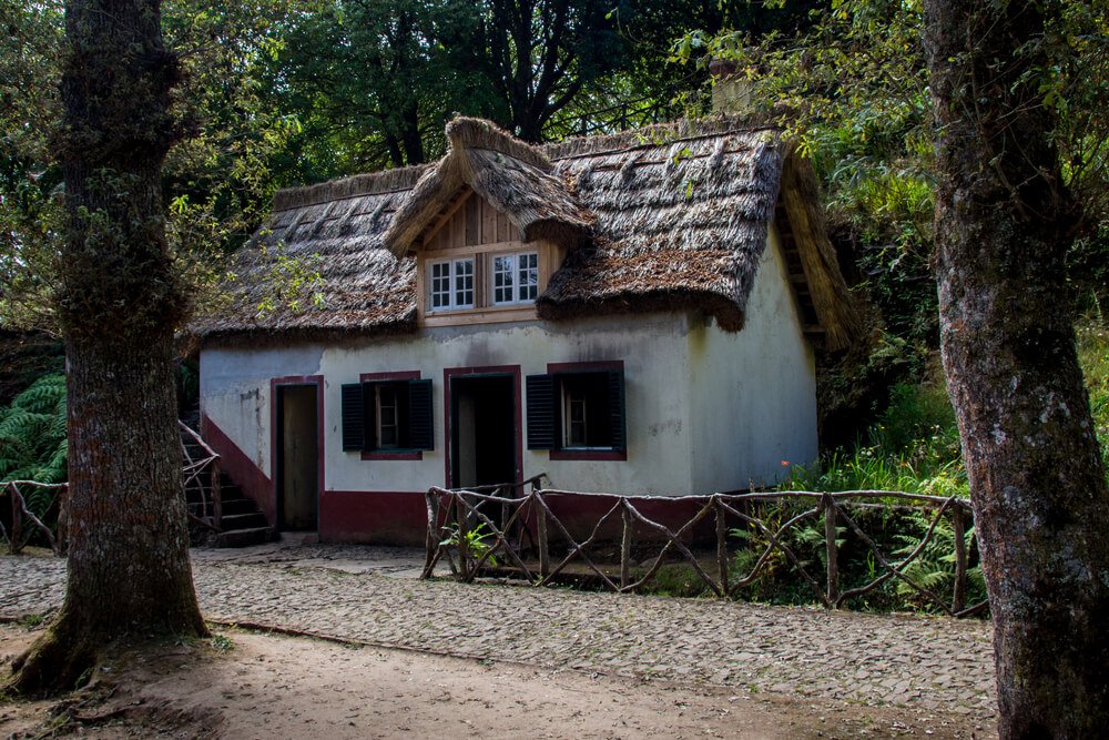 old hut, cabin, house with thatched roof in the woods. Located in Madeira, Portugal in the park Florestal das Queimadas.