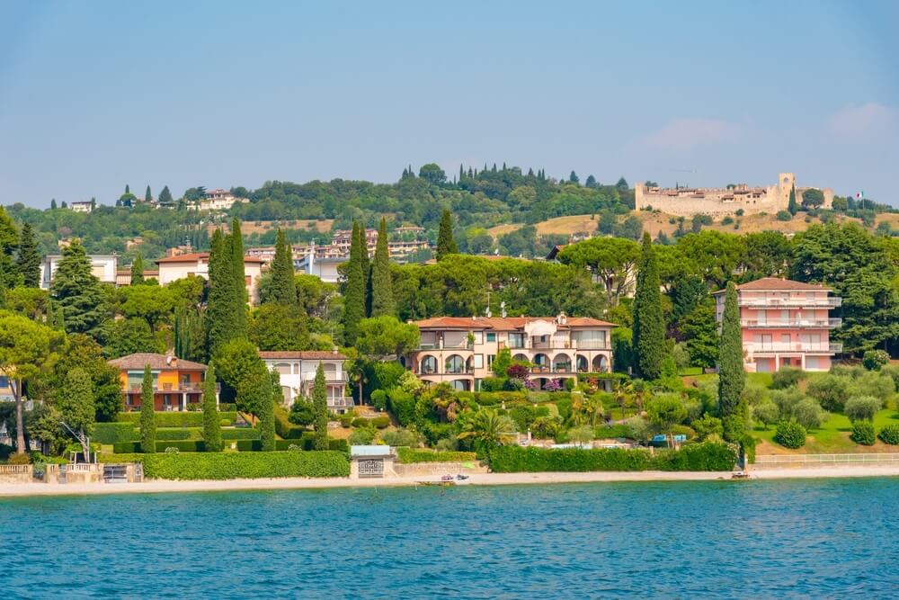 Padenghe sul Garda situated at Lago di Garda in Italy, castle in the top of the hill town and then villas on the face of the lake front