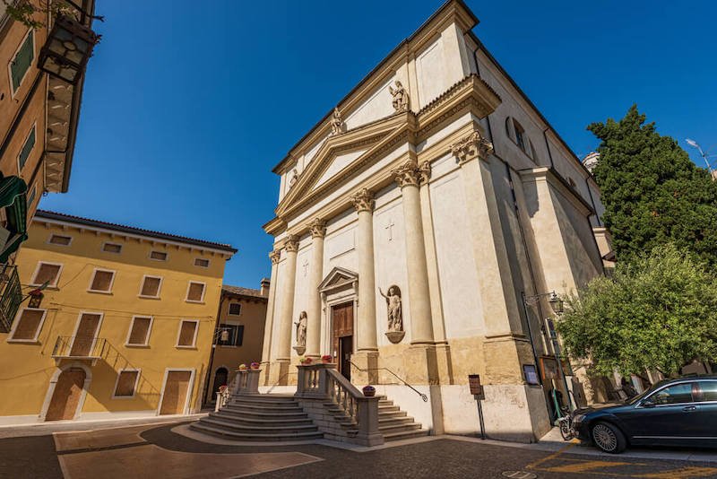 Facade of the parish church of the Saints Zenone and Martino in Neoclassical style, 1888, of the small village of Lazise, tourist resort on the coast of Lake Garda