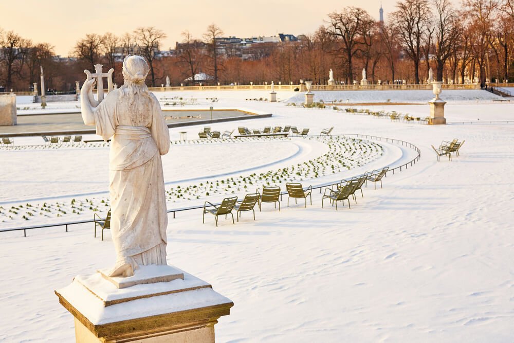 view of luxembourg garden covered in snow in paris in winter