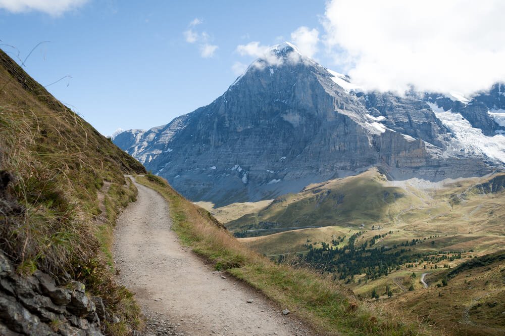 A scenic hike in the Swiss Alps from Kleine Scheidegg to Mannlichen. The area is at the base of the Jungfrau with views of the valley and the towns of Grindelwald, Wengen, and Lauterbrunnen.