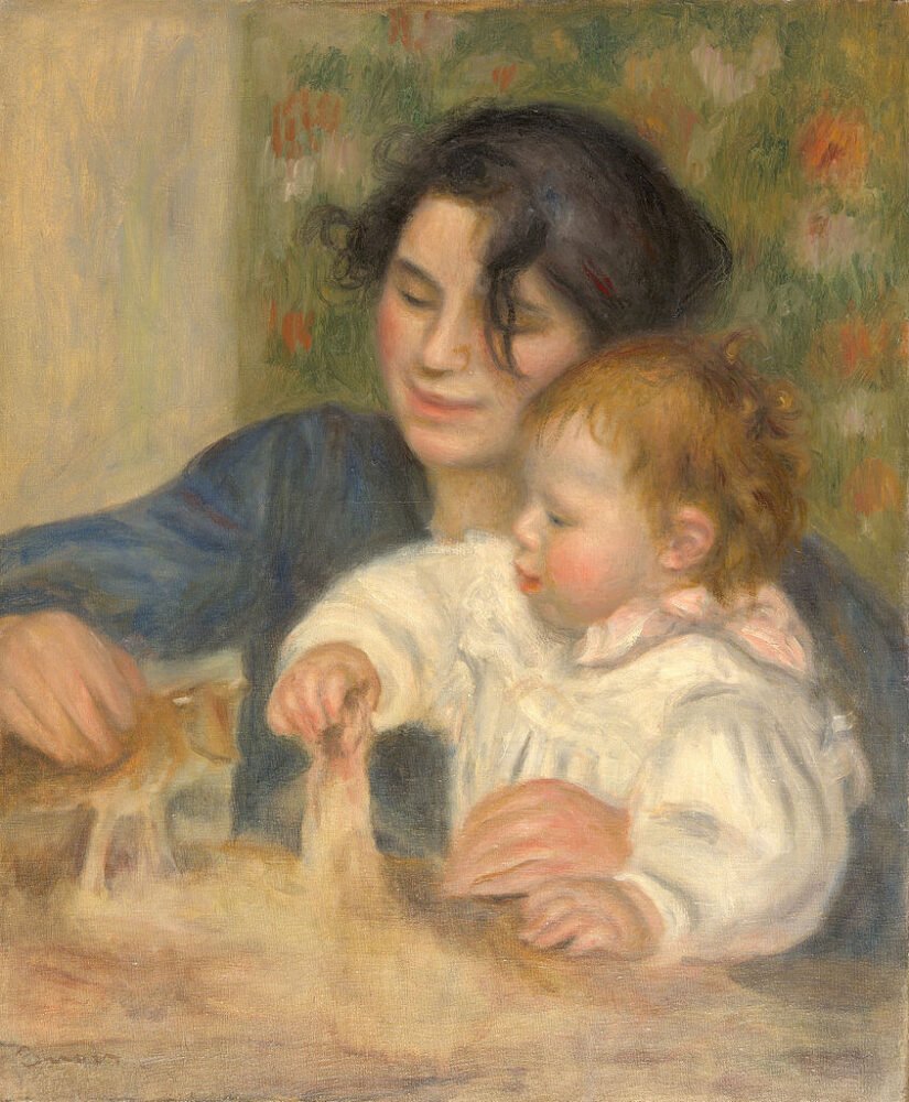 woman and her baby being painted in a portrait while playing with toys