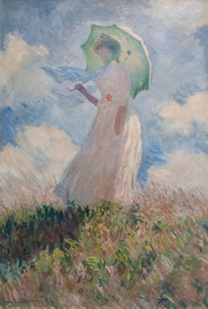 Essai de figure en plein-air : Femme à l'ombrelle tournée vers la droite, by Claude Monet with a girl holding an umbrella in the grass