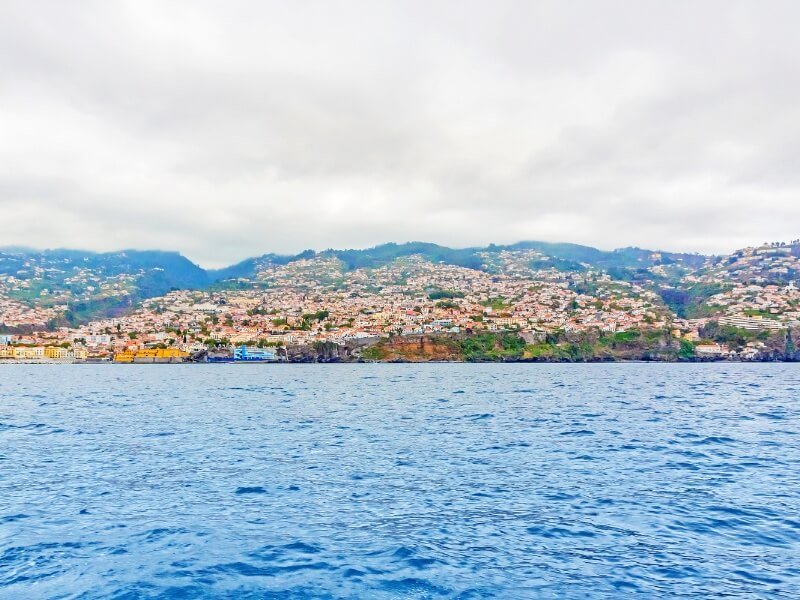 view from a madeira boat tour of the city of funchal and the landscape of madeira