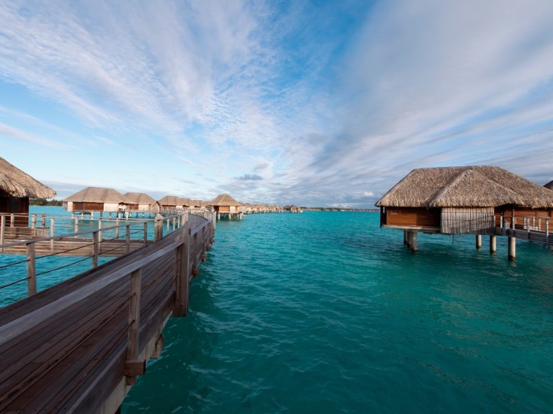 overwater bungalows with view of water