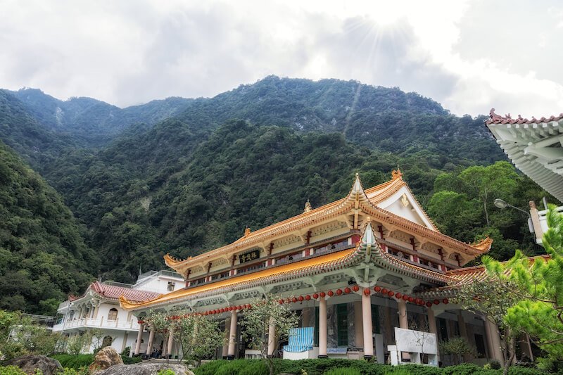 Xiangde temple in Taroko National Park with clouds in the sky and green hillsides