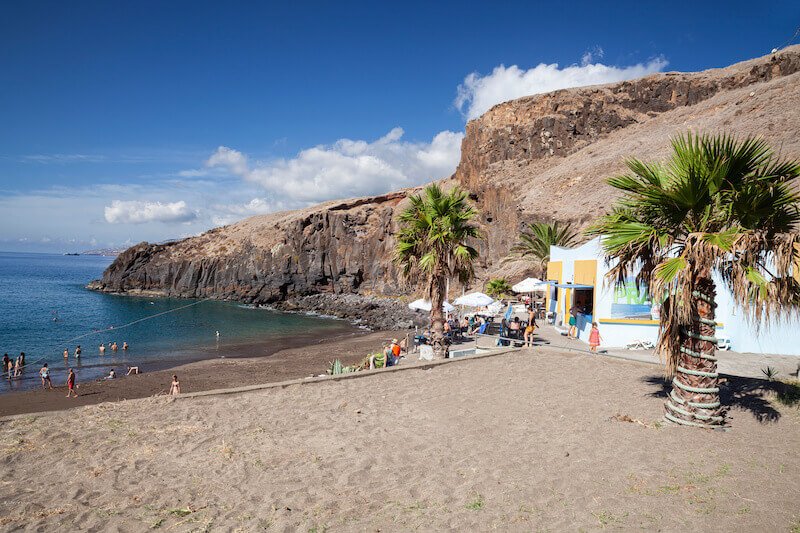 Beach of Canical near Ponta de Sao Lourenco in Madeira, Portugal with gorgeous landscape and dark sand and a small beach shack or restaurant