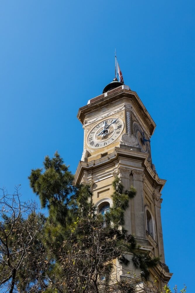 the famous clock tower of nice on a clear blue sky day