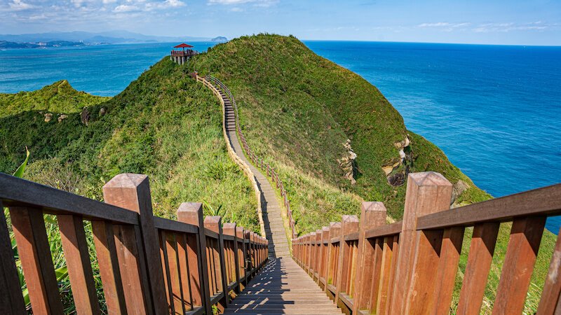 the beautiful landscape of taipei's coast with a hiking trail on the cape