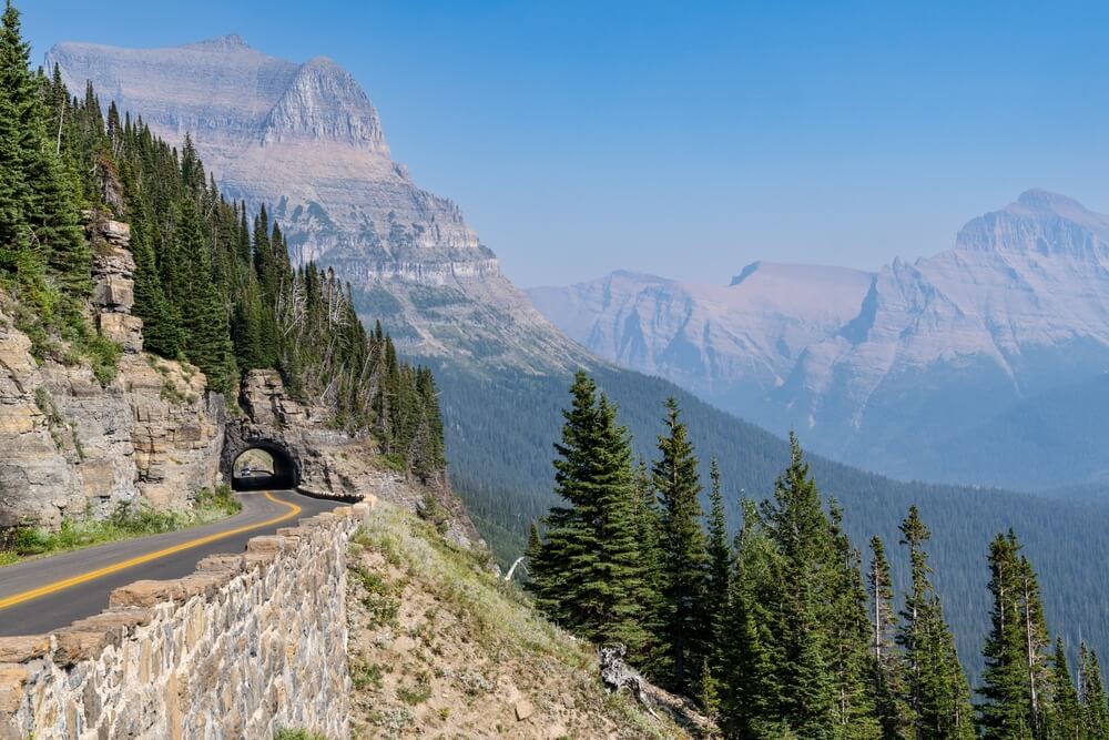 Tunnel along Going to the Sun Road in Glacier National Park on a hazy day
