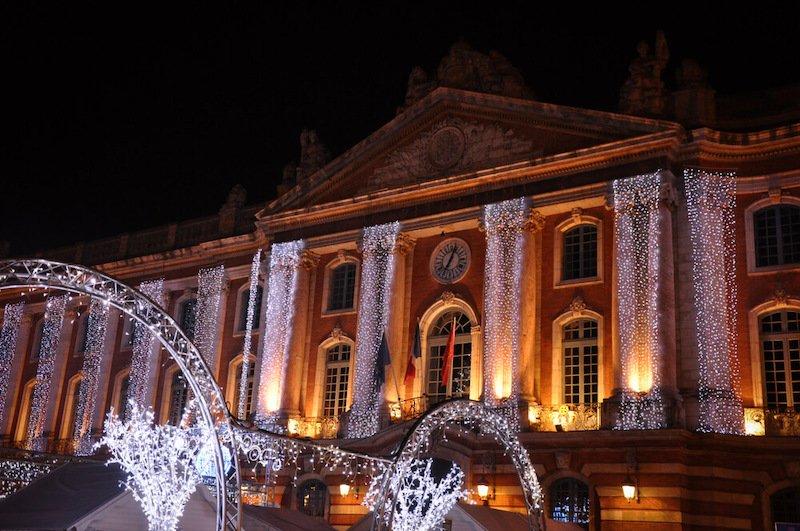 holiday scene at the capitole main square in toulouse in winter all decorated for the christmas season