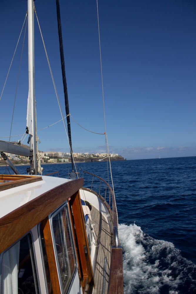 sailboat in the madeira waters on a sunny day with very few clouds