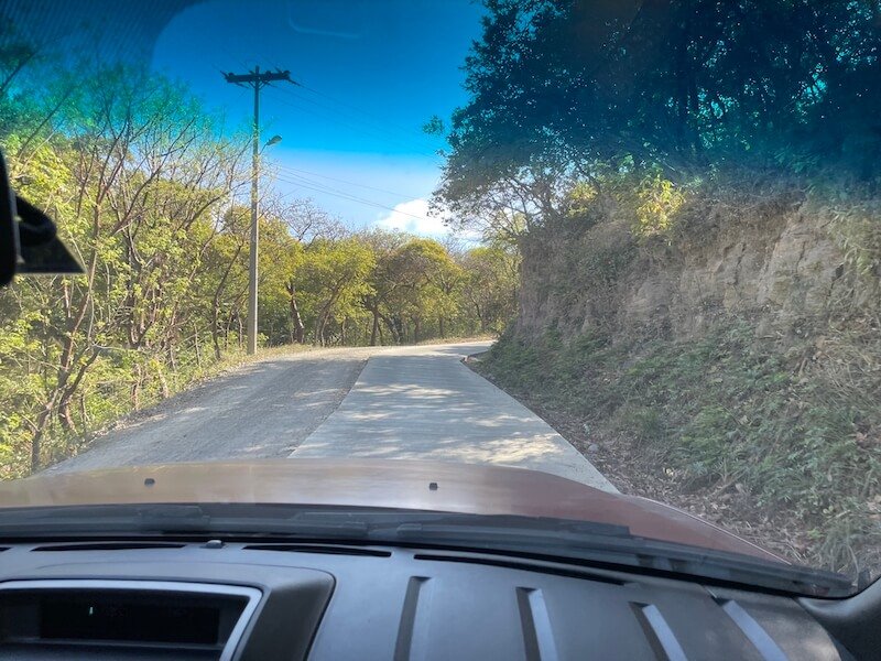 half the road paved half of it unpaved while driving in roatan