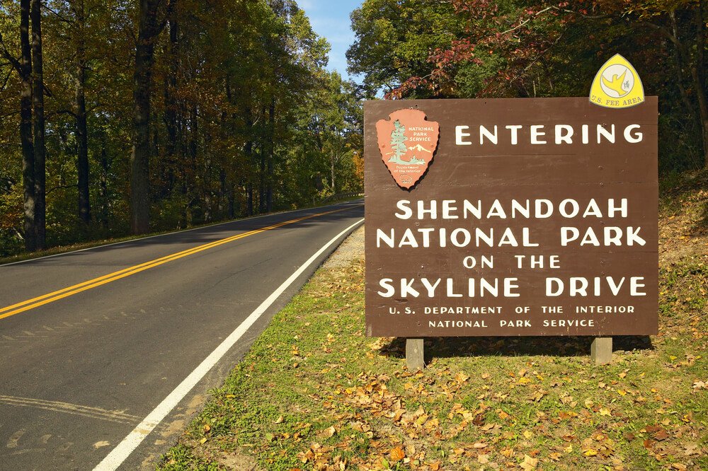 a sign that reads "entering shenandoah national park on the skyline drive" part of the national park service signage