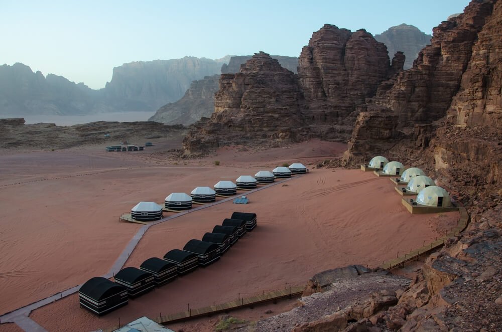 aerial view of wadi rum bubble hotel with desert landscape during the daytime