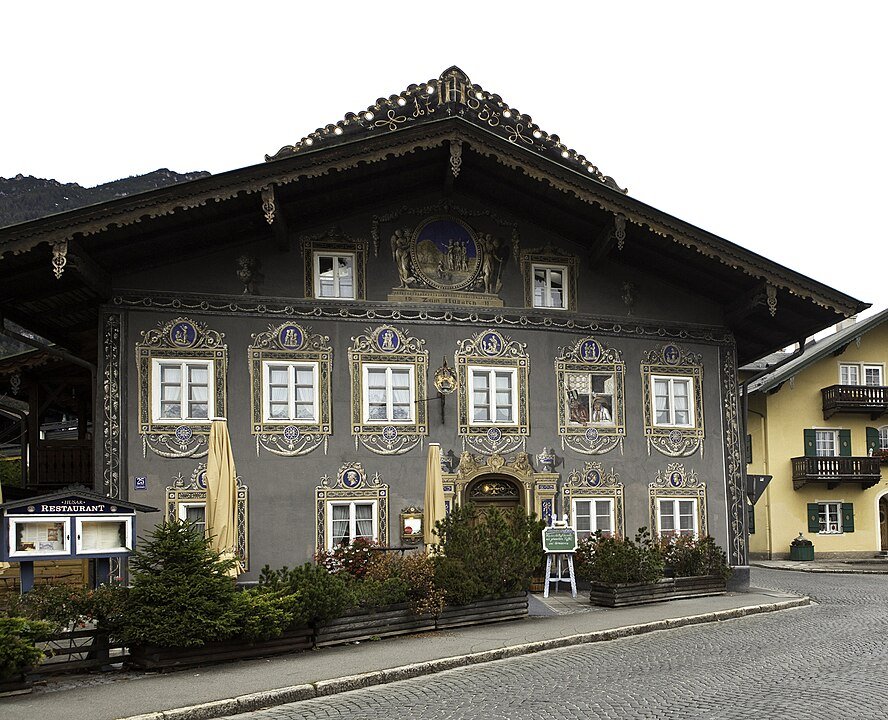 a very ornate painted building in the center of garmisch town which is actually just a restaurant called husar restaurant