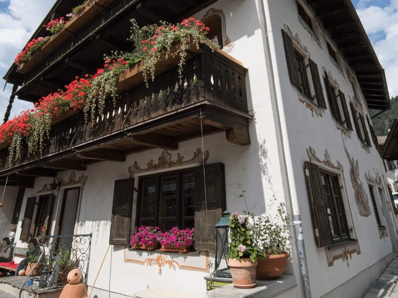 traditional house in bavaria with flower boxes in the summer