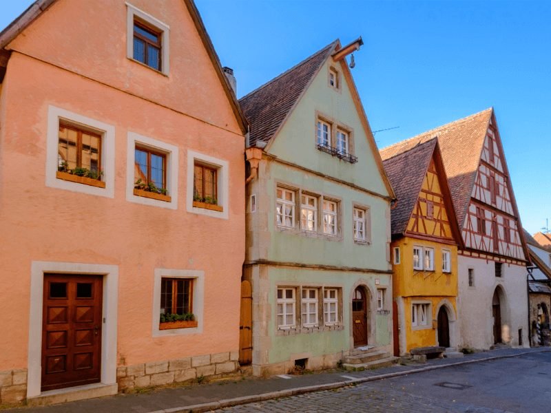 colorful houses of rothenberg ob der tauer with peach, green, yellow, and white colors