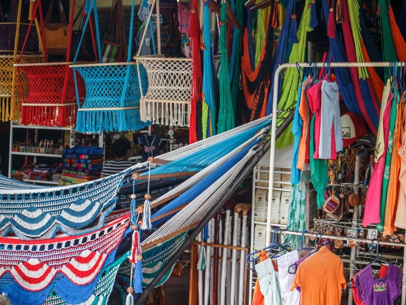 colorful woven hammocks and basket chairs in nicaragua at masaya market