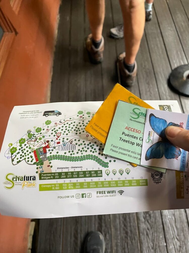 allison green holding her selvatura ticket with butterfly garden ticket and map of the park