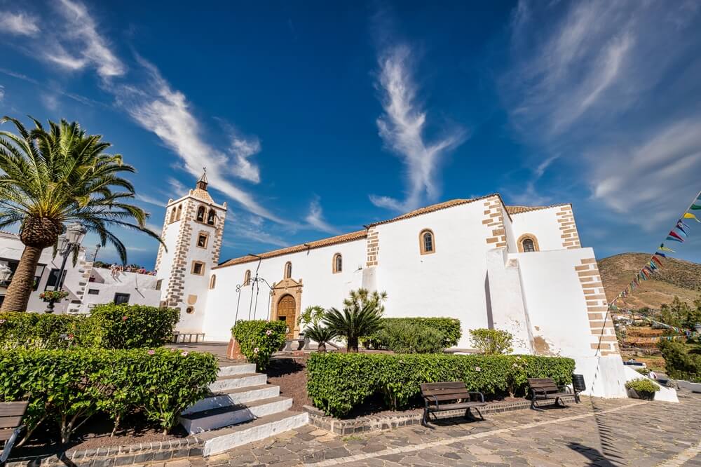 view of the town of betancuria with white washed architecture and plaza