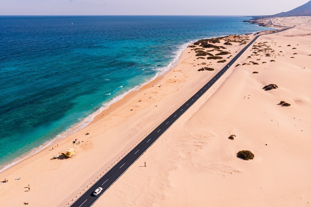 aerial view through the dunes of playa alzada on one side