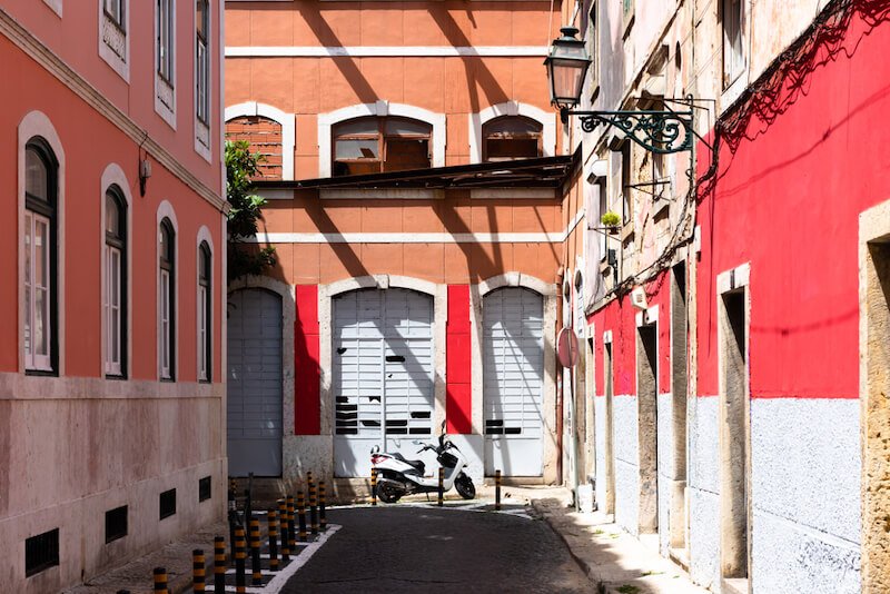 narrow road in provence with orange and red detail on the houses